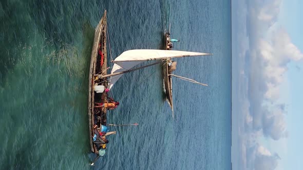 Vertical Video Boats in the Ocean Near the Coast of Zanzibar Tanzania Aerial View