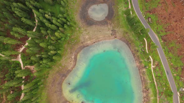 Aerial View of Turquoise Blue Water of Lake Carezza in Alps Dolomites