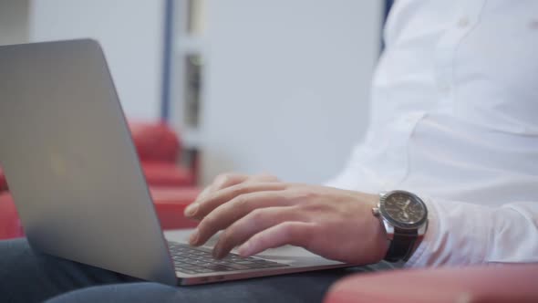 Close-up Of A Man's Hand Using Laptop