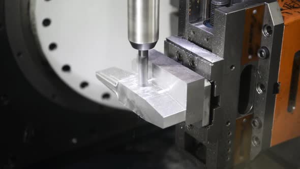 Precision Milling CNC Machine Tool Makes Part.