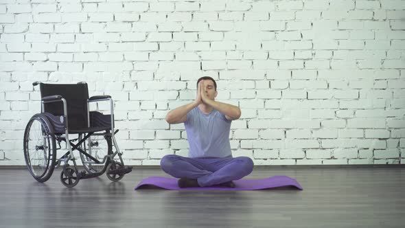 Disabled Man Doing Yoga Wheelchair and Exercise Mat