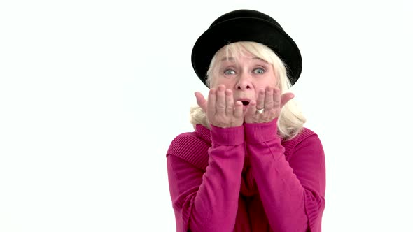 Senior Woman Sending Air Kisses