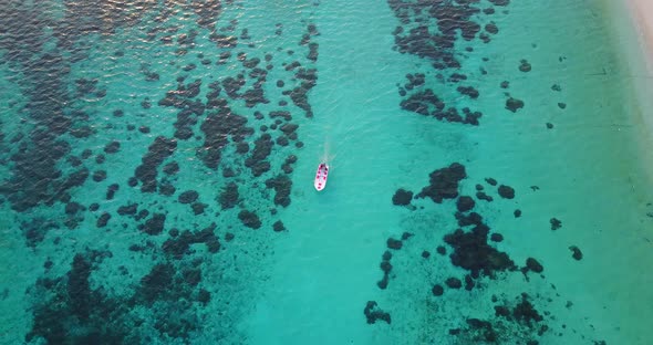 Natural birds eye abstract shot of a white sand paradise beach and aqua blue ocean background