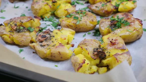 Baked smashed potatoes with herbs