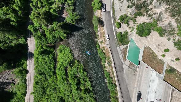 Aerial view of Provo River and traffic on the highway going through tunnel