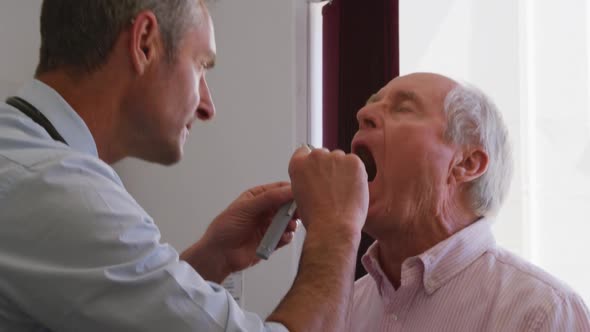 Doctor examining a senior man in a retirement home