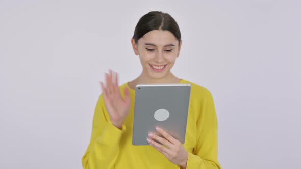 Video Call on Tablet by Spanish Woman on White Background
