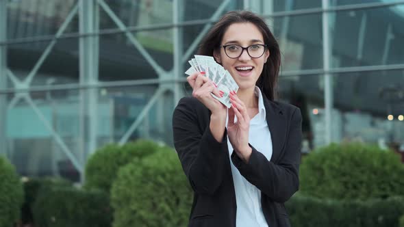 Young Business Ladyç Holding Money In Her Hands.