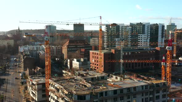 Aerial View of a Construction Site with Cranes and Heavy Machinery alt