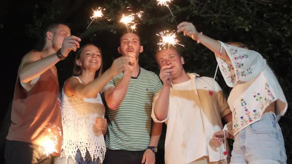 Group of friends with sparklers