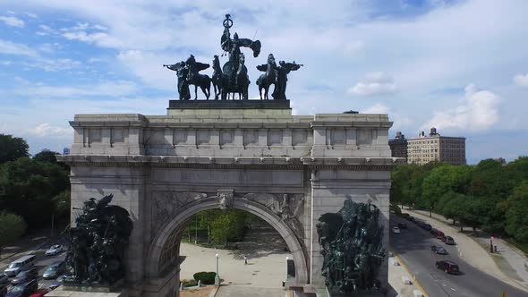 Beautiful Grand Army Plaza arch fly through revealing NYC skyline 4K.