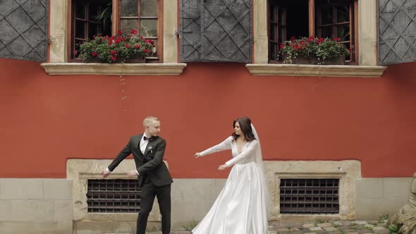 Newlyweds Lovely Wedding Caucasian Bride and Groom Dancing Trendy Dance Celebrating in City Street