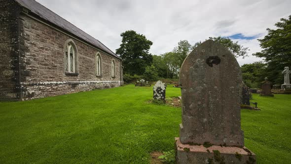 Motion time lapse of local historical Church of Ireland graveyard in rural country of Ireland during