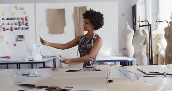 Mixed race woman working in creative office