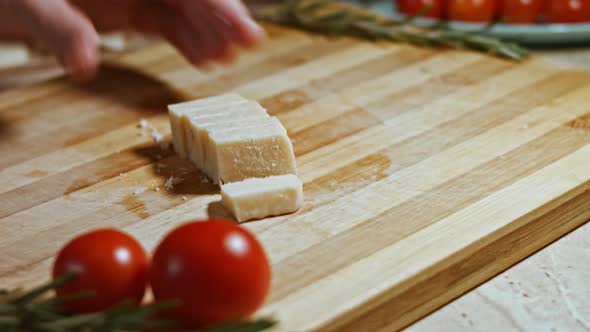 Gnocci with Tomato Sauce Being Sprinkled with Parmesan