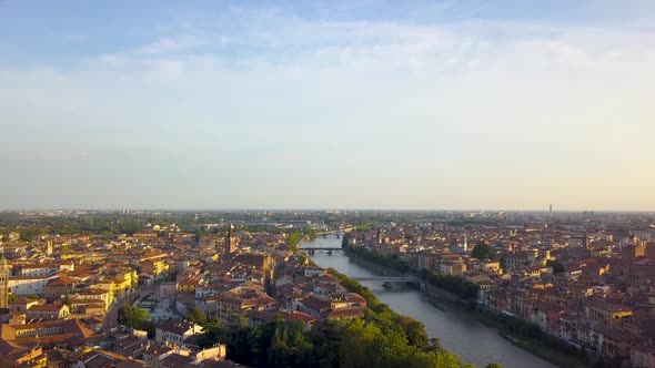 Aerial View of Verona City with Bridges Across Adige River Buildings with Red Tiled Roofs Italy