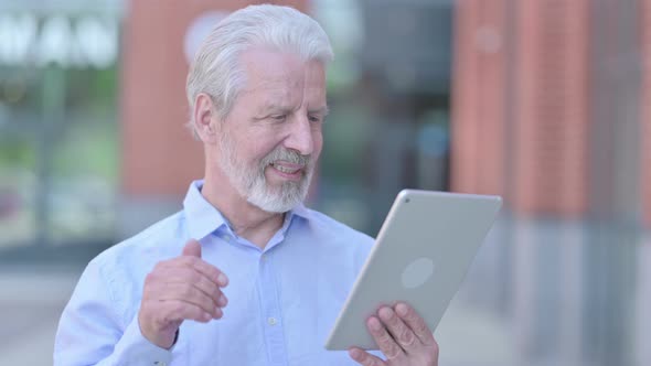 Outdoor Old Man Doing Video Chat on Tablet