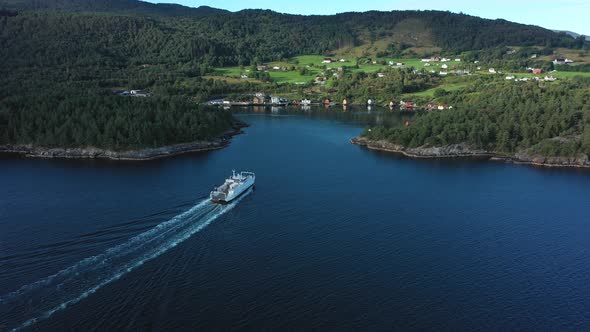 Norwegian car and passenger ferry Ytteroiningen approaching port of utbjoa - Beautiful aerial view f