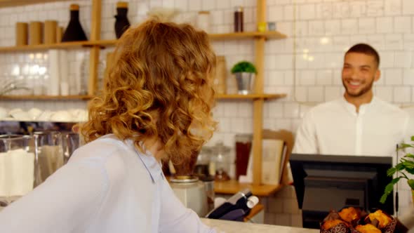 Customer and worker looking at each other 