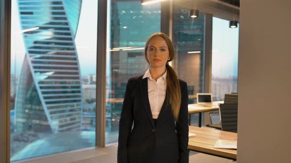 Portrait of Cheerful Businesswoman in Formal Playfully Posing on Camera Giving Like Sign with Thumb