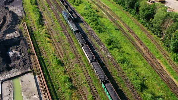 Freight train on the railway. Aerial drone view of freight train