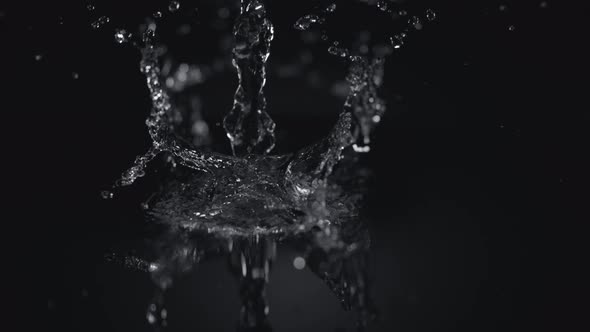 4K 30fps, Pouring water into puddle, Slow Motion