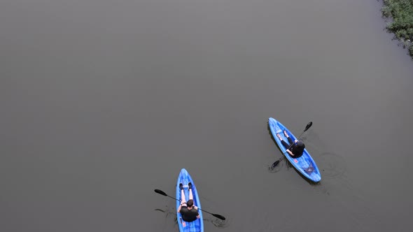 Kayaking in downtown Columbus, Ohio on the Scioto River on a misty day.