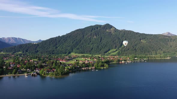 Aerial view of hot-air balloon above lake Tegernsee and Rottach-Egern