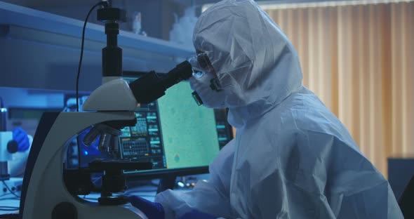 Scientist Examining Bacteria with Microscope alt
