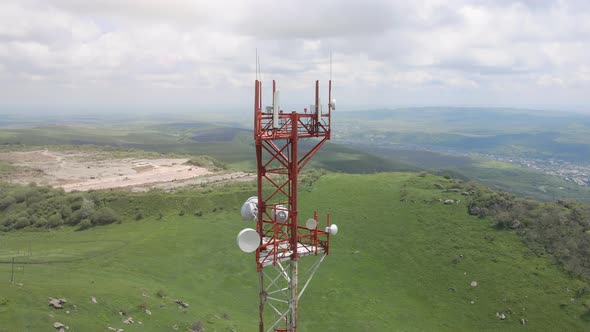 Aerial Flight Around the Telecom Tower Installed on the Top of the Hill