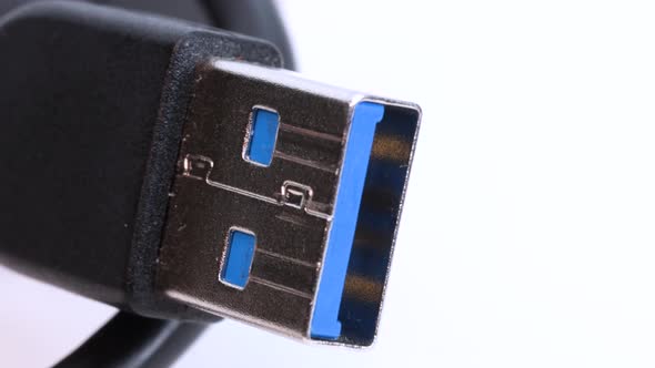 USB 3.0 connector plug, very close view macro shot. Detail video with rotation motion, white backgro
