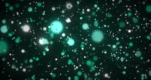 Animation of glowing green spots of light moving in hypnotic motion on green background