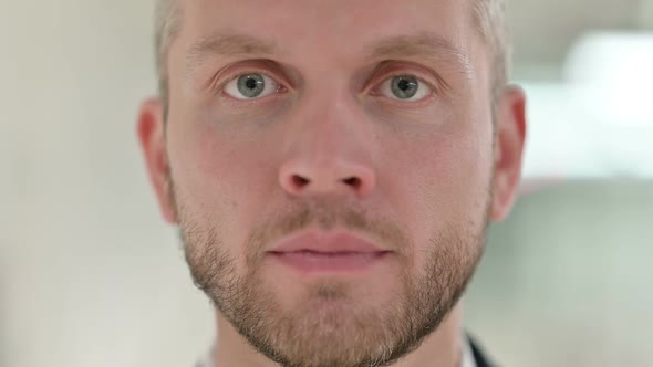 Close Up of Face of Serious Young Man