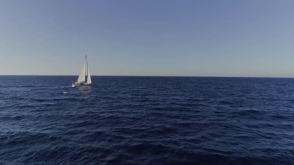 White Sailboat Sailing into Nowhere