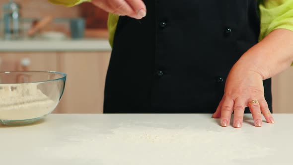 Hand Spreading Flour