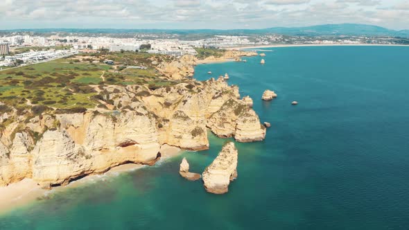 Sweeping view over Rugged sandstone cliffs lining Lagos coast, Algarve, Portugal