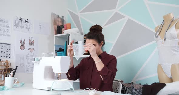 Seamstress Working in Her Atelier Studio with Sewing Machine