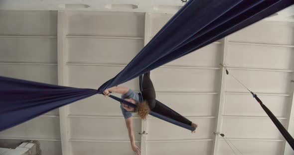 Aerial Silks Training in the Gym Low Angle View of a Woman Doing Gymnastics