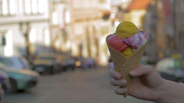 Ice-cream in Waffle Cone on Street Background