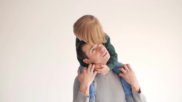 Son Sits on Father's Shoulders Happy Family Love Tenderness and Care