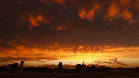 Sunset timelapse over city roof