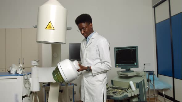 Portait of Handsome Young Confident Focused African Man Doctor Wearing White