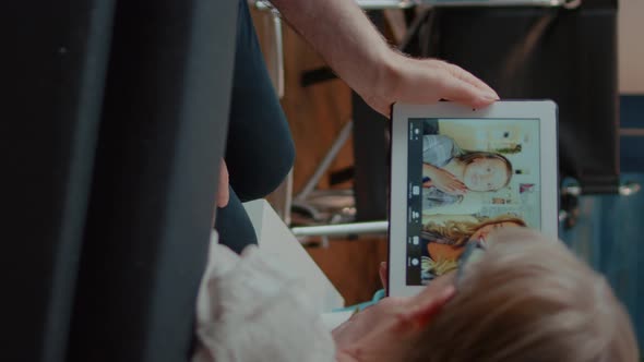 Vertical Video Grandparents Talking to Daughter and Niece on Online Video Call