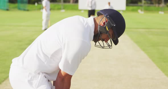 Cricket player standing and looking at the camera