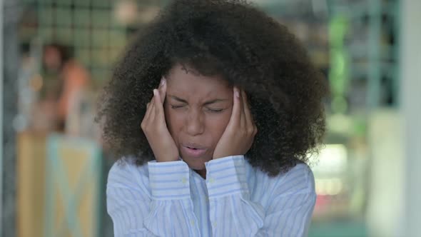 Portrait of Exhausted African Businesswoman Having Headache