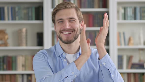 Portrait Shot of Happy Man Clapping Applauding