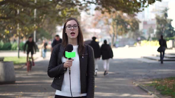 Girl Journalist Is Reporting on the Street