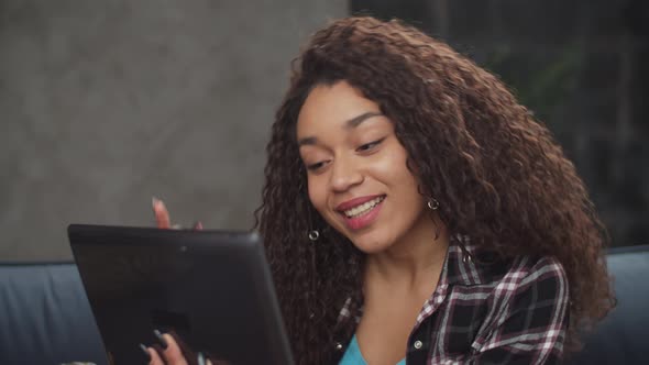 Portrait of Lovely Woman Making Video Call on Tablet Pc