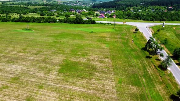 Aerial drone view of a flying over the rural agricultural landscape.