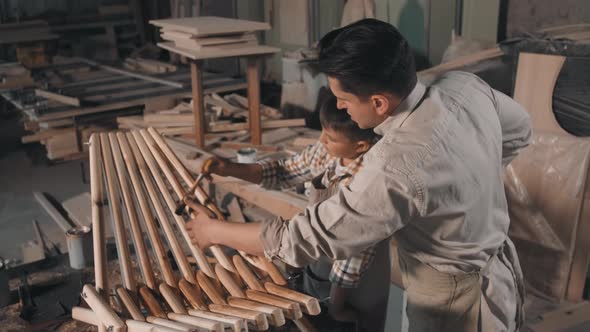 Carpenters Polishing Wood